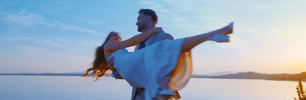 Groom spinning his bride during a sunset wedding portrait